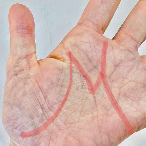 M-shaped palm meaning