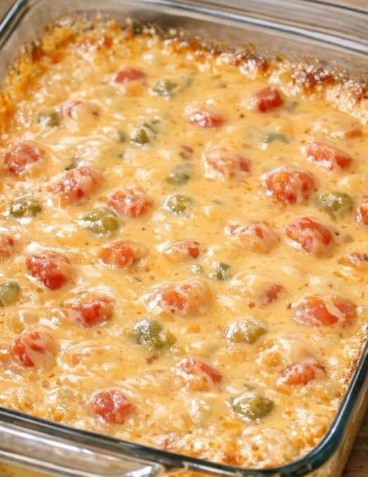 Make the best Southern 4-Ingredient Rotel Dip with Velveeta, ground beef, Rotel tomatoes, and milk. This creamy, cheesy party dip is ready in just 30 minutes!